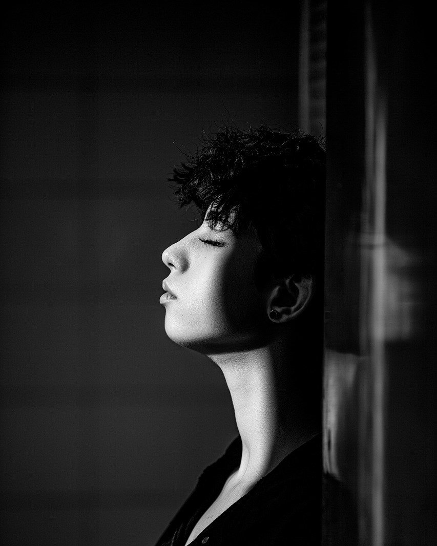 Serene black and white profile portrait with eyes closed