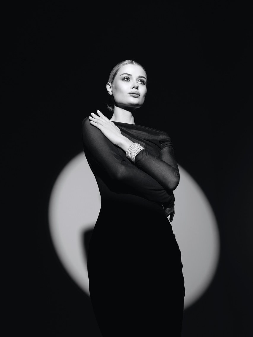Editorial fashion portrait with dramatic circular light